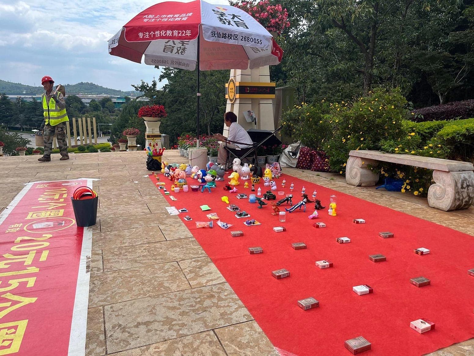 A ring game stall offers cigarettes as prizes near the Red Pagoda in Yuxi, China