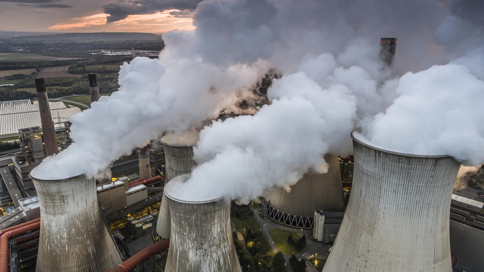 Factory towers billowing smoke