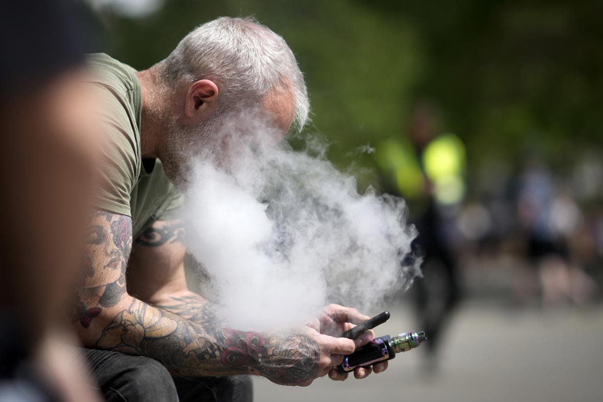 A man smokes a vape device on May 30, 2023 in Manchester, England.